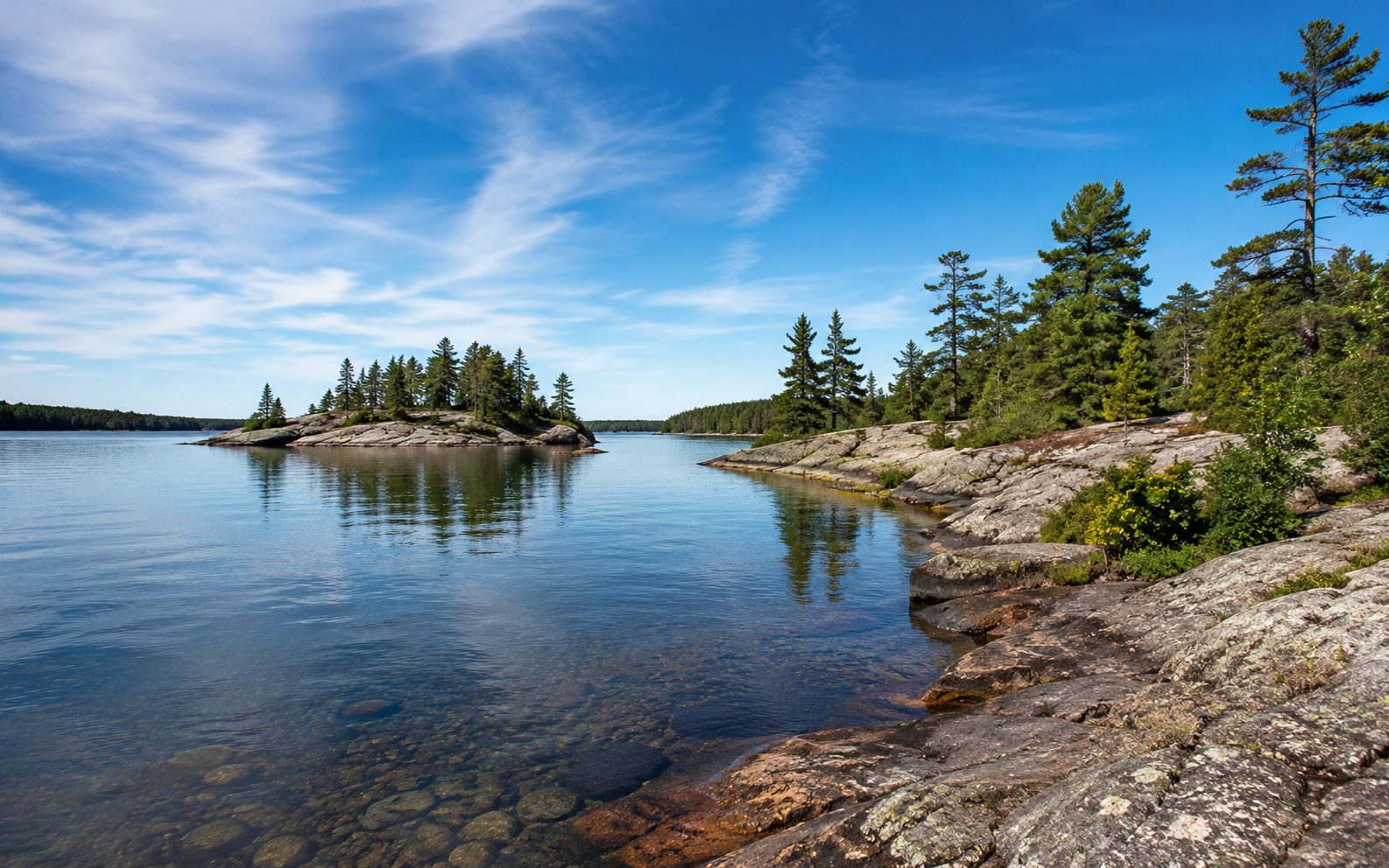Northern Ontario rocky shoreline, forest, and lake